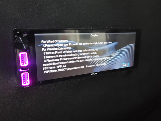 Showcasing the installation of a MP Play radio fully functional with display on.